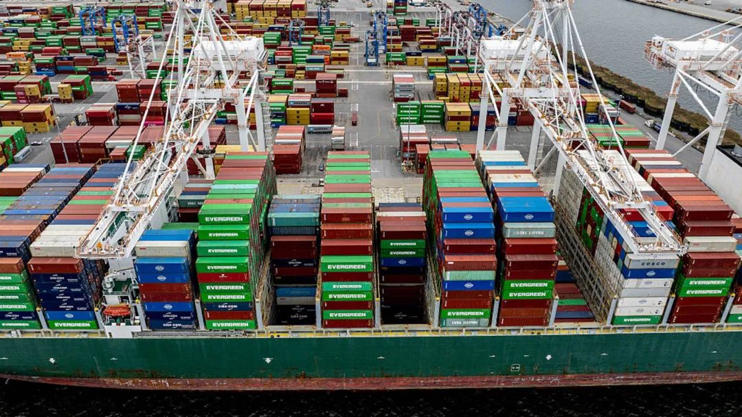 A cargo ship carrying shipping containers is moored to the pier at the Port of Baltimore on April 10, 2025, in Baltimore, Maryland. US President Donald Trump's 10 percent tariff for almost all countries except China will likely remain in place going forward, his top economic advisor Kevin Hassett said Thursday. On April 8, Trump announced a 90-day pause on higher tariffs against all countries except China, reversing a policy that had roiled global stock markets and spooked the American bond markets -- a key